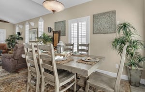 Gather around this rustic farmhouse dining table for memorable meals with loved ones in your bright, plantfilled sanctuary.