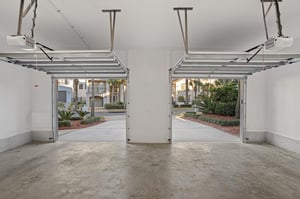 Private twocar garage offers secure parking with convenient automatic doors opening to beautiful landscaped grounds.