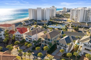 Prime beachfront location with pristine white sand beaches and turquoise waters just steps away from vacation rental properties.