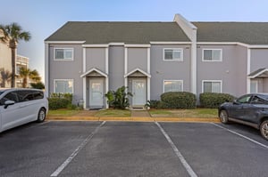 Modern townhousestyle building with convenient parking spaces directly outside each units entrance.