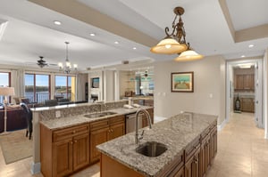 Your spacious kitchen features granite countertops, rich wood cabinets, and gleaming fixtures for creating memorable meals together.
