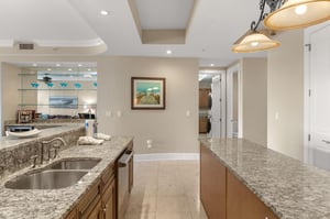 Your spacious kitchen invites culinary adventures with granite countertops, modern appliances, and elegant pendant lighting creating the perfect cooking sanctuary.
