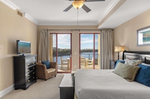 Wake up to breathtaking water views through your private balcony doors. Elegant furnishings and coastal charm create the perfect retreat for rest and relaxation.