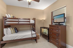 Your family will love this cozy bedroom with sturdy bunk beds, complete with a TV for movie nights and plenty of storage.