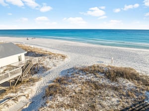 Pristine white sand beach stretches endlessly along turquoise waters, with a dedicated beach access just steps away offering direct access to this coastal paradise.