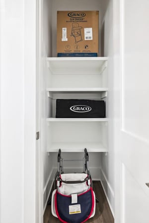 The organized storage closet keeps baby essentials neatly arranged and ready when you need them.