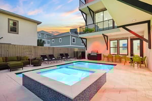 Relax in the private oasis with a sparkling pool and spa, surrounded by modern comfort and stunning sunset views.