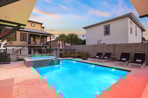 Dive into the private pool where turquoise waters meet comfortable loungers under painted evening skies.