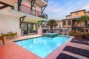 Your private pool oasis awaits with crystalclear waters, cozy outdoor seating, and a relaxing spa under the evening sky.