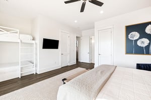 Your spacious bedroom features a cozy bunk bed and plush king bed, with a wallmounted TV for movie nights.