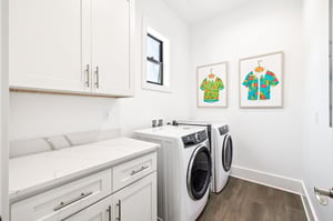 One of the dedicated laundry room makes staying fresh effortless with modern appliances and plenty of counter space for folding.