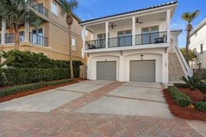 Twostory coastal home featuring a spacious covered balcony and convenient twocar garage in the beautifully landscaped neighborhood of Dunes of Destin