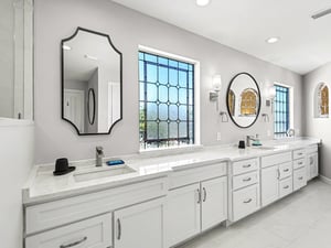 Pamper yourself in this stunning bathroom with dual vanities, marble countertops, and elegant mirrors perfect for your morning routine.