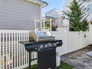 Fire up the grill and savor outdoor cooking in your private backyard space, perfectly positioned for memorable meals.