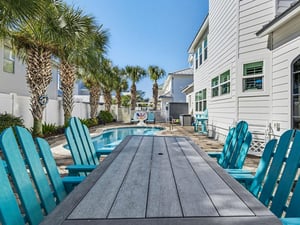 Gather around your private pool table for meals with tropical palm trees swaying overhead and crystalclear water just steps away.