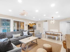 Relax in your spacious openconcept living space with plush sectional seating, natural light, and modern kitchen—perfect for memorable gatherings.