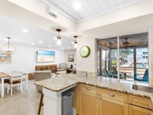 Open kitchen flows seamlessly into the living and dining areas, perfect for gathering with loved ones while preparing meals together.