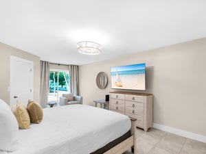Drift off to sleep in your serene bedroom with fountain views, coastal artwork, and thoughtful touches.