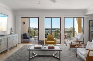 Settle into your stylish living room where natural light streams through French doors leading to your private balcony with stunning views.