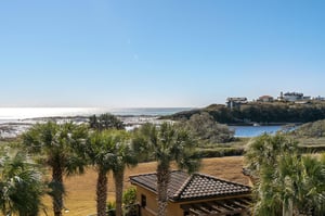 Stunning coastal panorama showcasing pristine gulf beaches, and rolling dunes.
