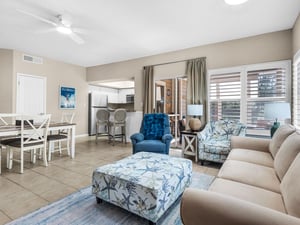 Unwind in your spacious living area where coastal blues meet comfort—perfect for relaxing after beach days.