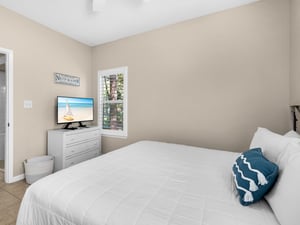 Drift off to sleep in your comfortable bedroom, complete with flatscreen TV and coastal touches for ultimate relaxation.