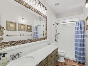 Unwind in your stylish bathroom with gorgeous mosaic accents and warm lighting creating the perfect spalike retreat.