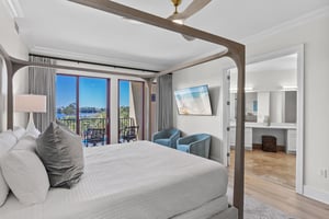 Wake up to stunning water views from your elegant fourposter bed, then step onto your private balcony for morning coffee.