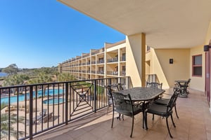 Step onto your private balcony to enjoy morning coffee with stunning pool views and coastal scenery stretching to the horizon.