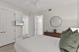 Sink into crisp linens and unwind in your serene bedroom, complete with modern amenities and thoughtful touches for ultimate relaxation.