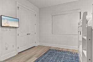 Your kids will love this cozy bunk room with a flatscreen TV for bedtime stories and morning cartoons.