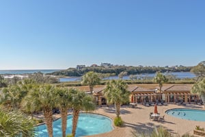 Sweeping coastal views stretch across pristine beaches and azure waters from this elevated gulf front location.