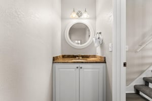 The half bathroom is conveniently located in the main living area