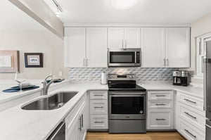 The fully equipped kitchen offers stainless steel appliances