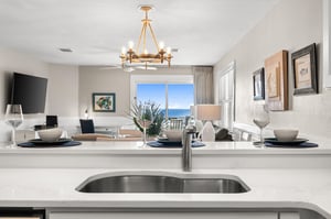 The elegant kitchen island is the perfect gathering spot, with stunning Gulf views creating a backdrop for memorable meals and conversations.