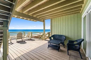 Relax on the Private Balcony accessible by the garage level bedroom