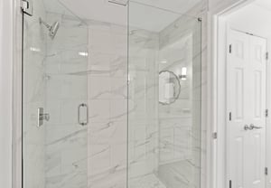 Step into the spalike marble shower.