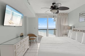 Bedroom 1 features direct access to the private balcony