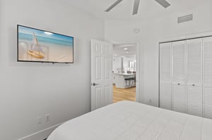 This queen bedroom would not be complete without the wall mounted TV.