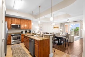 This spacious openconcept kitchen flows seamlessly into the dining and living areas, perfect for entertaining.