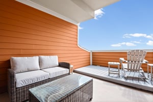 Sink into plush outdoor cushions while enjoying open sky views from your private terrace, complete with stylish seating.