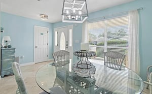 Dining area, perfect place for meals or family game time. Additional seating at breakfast bar in kitchen.