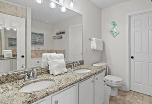 Bathroom 1  Step into your bright bathroom featuring granite countertops, dual sinks, and fresh towels waiting for your arrival.