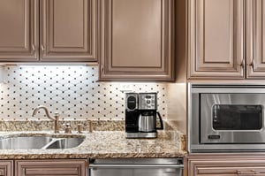 Gourmet kitchen with granite counters, elegant cabinetry, and premium appliances.