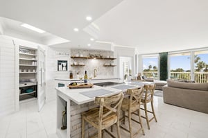 Gather around your stunning kitchen island while sunlight streams through the windows
