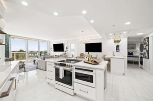 The kitchen flows seamlessly into the living space, featuring premium appliances and stunning gulf views for memorable meals.