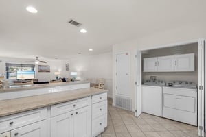 A  laundry center is conveniently located adjacent to the kitchen