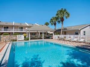 The perfect poolside retreat awaits under endless blue skies.