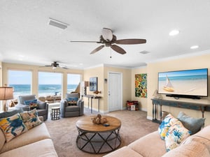 Relax in your bright beachfront living room with sweeping ocean views and coastalthemed comfort.