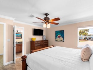 Drift off to sleep inthe spacious Guest bedroom with tropical artwork creating a coastal sanctuary.